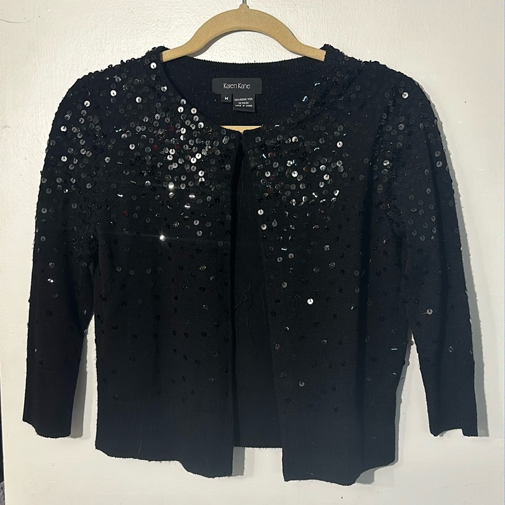 Woman’s Karen Kane 100% Moreno Wool Sequins black buttonless sweater. Size M.